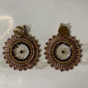 Francesca’s Purple beaded dream weaver earrings